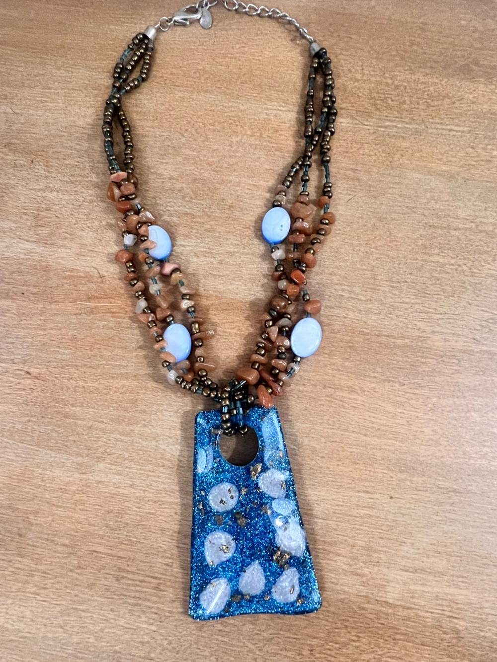 Handcrafted Blue Pendant Necklace with Brown Beaded Strands